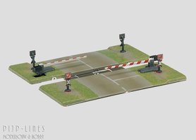 Spoorwegovergang met halve bomen