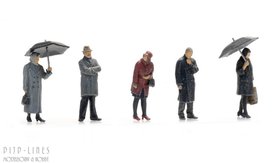 Passagiers in de regen